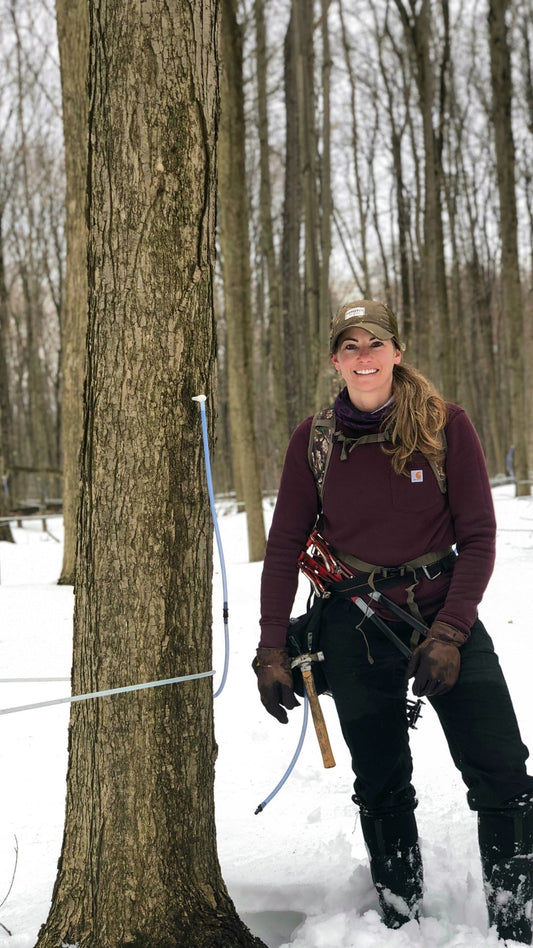 The Maple Farmer standing next to a sugar maple tree